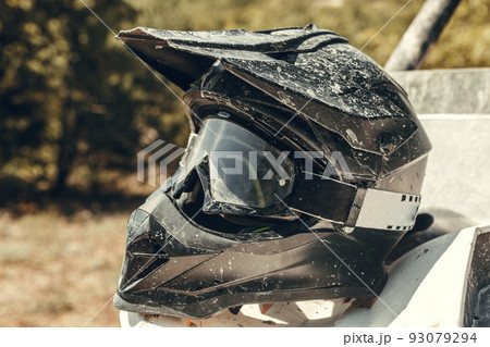Dirty motorcycle motocross helmet with goggles 93079294