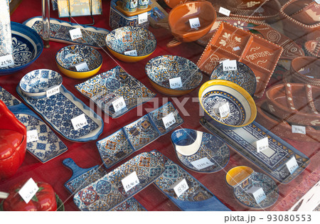 Souvenirs Background with colorful Portuguese blue ceramics Souvenirs Background with colorful Portuguese blue ceramics 93080553