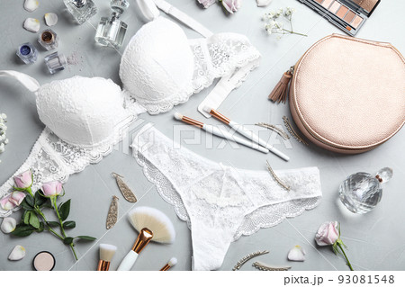 Flat lay composition with elegant women's underwear on light grey stone background 93081548
