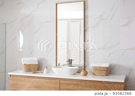 Large mirror and vessel sink in bathroom Large mirror and vessel sink in bathroom 93082366