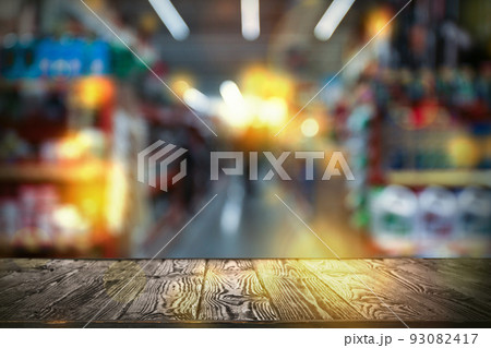 Empty wooden surface and blurred view of shopping mall. Space for design Empty wooden surface and blurred view of shopping mall. Space for design 93082417