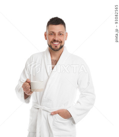 Handsome man in bathrobe with cup of coffee on white background Handsome man in bathrobe with cup of coffee on white background 93082565