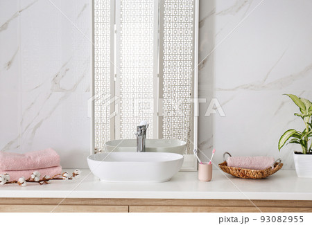 Modern mirror and vessel sink in stylish bathroom Modern mirror and vessel sink in stylish bathroom 93082955