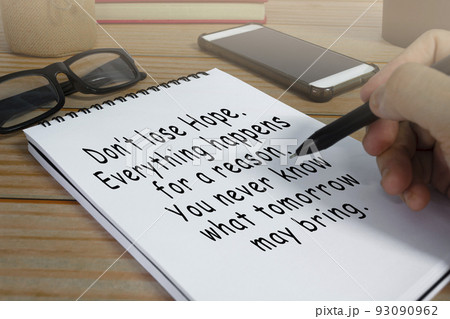 Motivational and inspirational quote written on notepad . Motivational and inspirational quote written on notepad . 93090962
