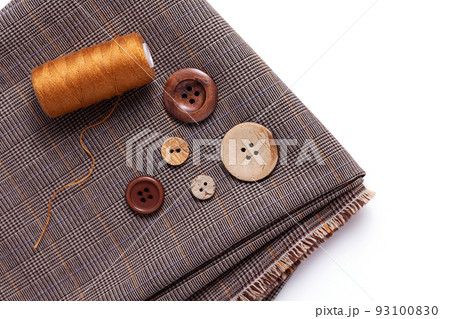 Tailor or sewing accessories and supplies on white  background. Creative concept with folded fabric 93100830