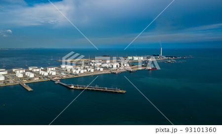 Aerial view oil terminal and coal power plant station in sea, White oil storage tank chemical petroleum petrochemical refinery product, Tanker ship at deep ocean seaport terminal. Aerial view oil terminal and coal power plant station in sea, White oil storage tank chemical petroleum petrochemical refinery product, Tanker ship at deep ocean seaport terminal. 93101360