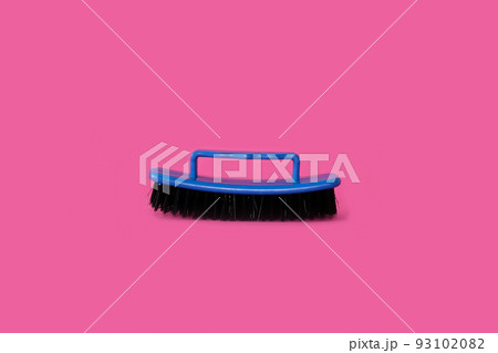 Brush for clothes on a bright pink background 93102082