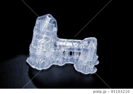 Abstract model printed on 3d printer close-up. Object photopolymer printed on stereolithography 3D printer. Technology of liquid photopolymerization under UV light. New additive 3D printing technology Abstract model printed on 3d printer close-up. Object photopolymer printed on stereolithography 3D printer. Technology of liquid photopolymerization under UV light. New additive 3D printing technology 93103210