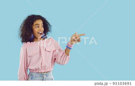 Happy biracial teenager point at copy space aside 93103691