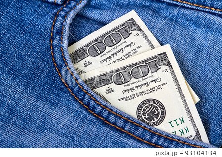Hundred dollar bills in jeans pocket Hundred dollar bills in jeans pocket 93104134
