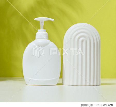 White plastic container with a pump for cosmetic liquid 93104326