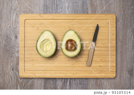 ripe haas avocados on cutting board ripe haas avocados on cutting board 93105314
