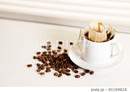 Coffee drip bag and coffee beans. Coffee drip bag and coffee beans. 93109628
