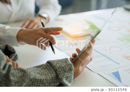 Fund managers team consultation and discuss about analysis Investment stock market by digital tablet. Fund managers team consultation and discuss about analysis Investment stock market by digital tablet. 93113549