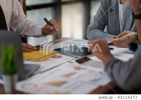 Administration or Accountant discussing with partner are meeting to audit finance planning sales to meet targets set in next year. Finance concept. Administration or Accountant discussing with partner are meeting to audit finance planning sales to meet targets set in next year. Finance concept. 93114372