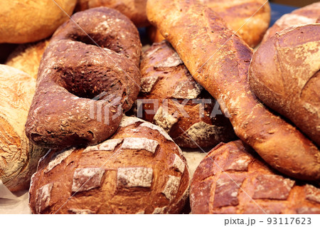 varied bread loaves on a bakery shop counter 93117623