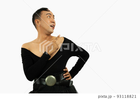 gay man in a black dress pointing something. Transgender isolated on white color background. LGBTQ+ concept. 93118821