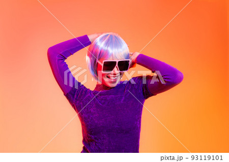 Cyber punk girl concept, asian woman in purple sweatshirt silver and blue short hair style wearing sunglasses posing dancing like robot Cyber punk girl concept, asian woman in purple sweatshirt silver and blue short hair style wearing sunglasses posing dancing like robot 93119101