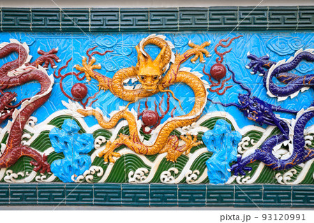 Yellow dragon on blue background, ceramics. Nine-Dragon Wall at Garden of Friendship, St. Petersburg, Russia. This is copy of the wall in Shanghai. Yellow dragon on blue background, ceramics. Nine-Dragon Wall at Garden of Friendship, St. Petersburg, Russia. This is copy of the wall in Shanghai. 93120991