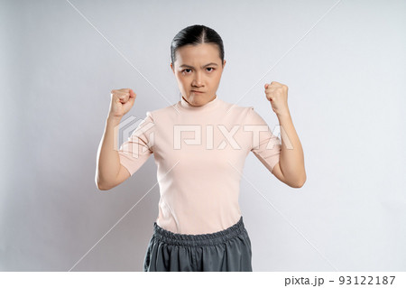 Asian woman angry standing on isolated background. Asian woman angry standing on isolated background. 93122187