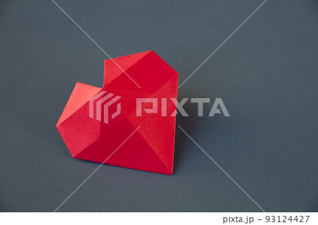 Red paper heart origami isolated on a grey background 93124427