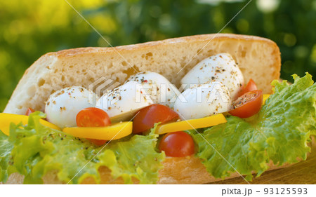 Sandwich with mozzarella tomato and lettuce 93125593
