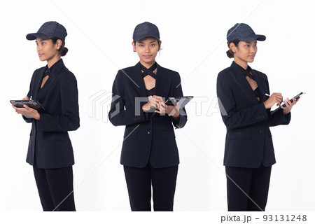 Half body person of young adult tanned skin woman work hard on digital tablet. Asian Female smile cheerful in black dress over white background isolated Half body person of young adult tanned skin woman work hard on digital tablet. Asian Female smile cheerful in black dress over white background isolated 93131248