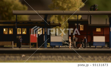 Model train at model railroad. People at miniature railway station. Model railway exhibition. 93131873