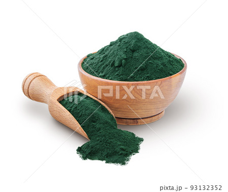 Wooden scoop and bowl full of spirulina powder isolated on white 93132352