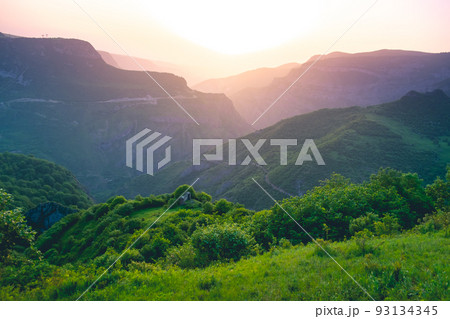 Sunset mountain highland canyon green field meadow 93134345