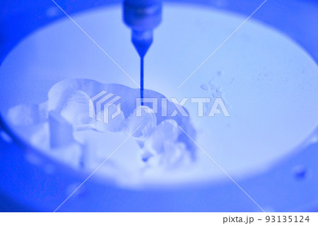 Dental milling machine carving out shape of human teeth close-up. Modern medical technologies. Concept of 4.0 industrial revolution 93135124