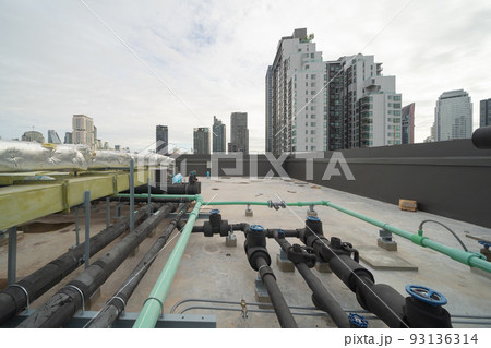 Chiller tower or cooling tower on rooftop of a office building in urban city. System work. Architecture machine. Condenser Water Supply and Condenser Water Return pipe lines. Ventilation compressor. Chiller tower or cooling tower on rooftop of a office building in urban city. System work. Architecture machine. Condenser Water Supply and Condenser Water Return pipe lines. Ventilation compressor. 93136314