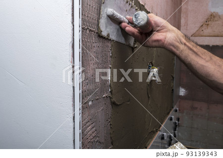 adhesive, architecture, bathroom, bathroom renovation, builder, building, cement, ceramic tile laying, ceramic wall tiles, concrete, construction, construction worker, contractor, cuts tile, decoratio adhesive, architecture, bathroom, bathroom renovation, builder, building, cement, ceramic tile laying, ceramic wall tiles, concrete, construction, construction worker, contractor, cuts tile, decoratio 93139343