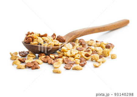 Breakfast cereal flakes in wooden spoon isolated on white background. 93140298