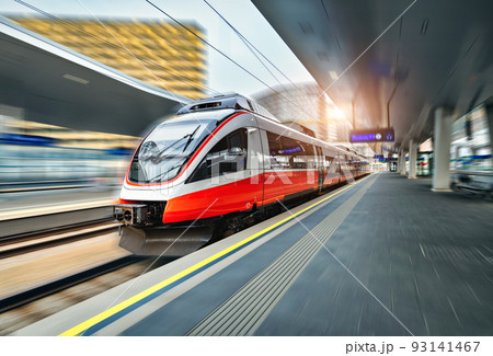 High speed train in motion on the railway station at sunset 93141467