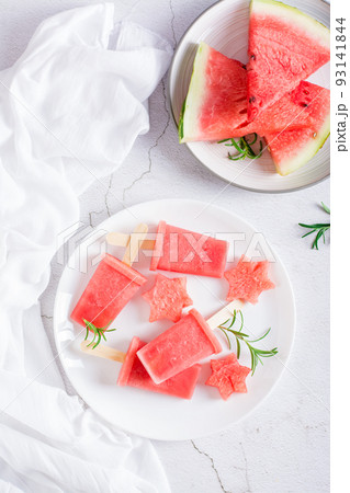 Watermelon ice cream  and pieces of watermelon on a plate. Homemade dessert. Top and vertical view 93141844