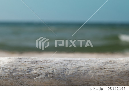 Mock-up for product presentation, wooden base and beach backdrop. Mock-up for product presentation, wooden base and beach backdrop. 93142145