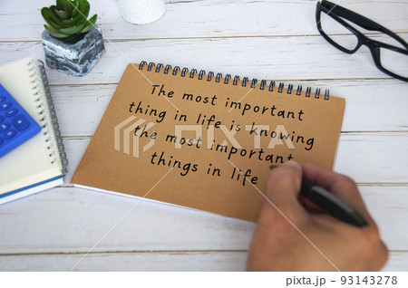 Motivational and inspirational quote about the most important thing in life. With hand writing on brown paper notepad. Motivational concept 93143278