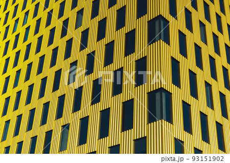Modern office building exterior with glass facade on clear sky background. Transparent glass wall of office building with yellow decoration. Element of facade of modern European building Commercial Modern office building exterior with glass facade on clear sky background. Transparent glass wall of office building with yellow decoration. Element of facade of modern European building Commercial 93151902