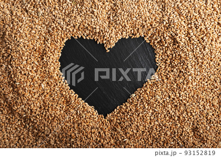 Heart shaped copy-space on wheat grain background flat lay Heart shaped copy-space on wheat grain background flat lay 93152819