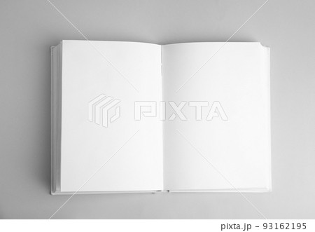Open book with blank pages on grey background, top view Open book with blank pages on grey background, top view 93162195