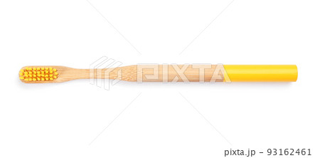 Bamboo toothbrush with yellow bristle isolated on white, top view Bamboo toothbrush with yellow bristle isolated on white, top view 93162461
