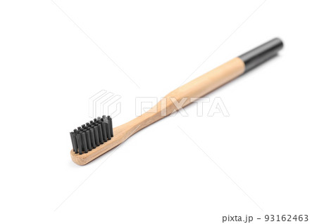 Bamboo toothbrush with charcoal bristle isolated on white Bamboo toothbrush with charcoal bristle isolated on white 93162463