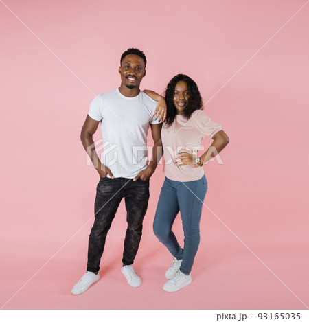Full length view african american woman in casual outfit leaning on man standing with hands 93165035