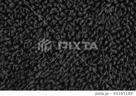 Faux fur black wool abstract pattern nature skin soft warm fluffy background dark artifical texture Faux fur black wool abstract pattern nature skin soft warm fluffy background dark artifical texture 93165189