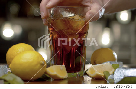 Male hand putting a glass on the table 93167859