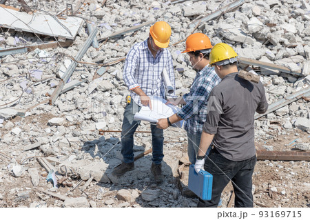 Engineer architect and worker operation control demolish old building. 93169715