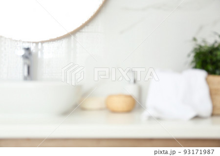 Blurred view of stylish modern bathroom with toiletries Blurred view of stylish modern bathroom with toiletries 93171987
