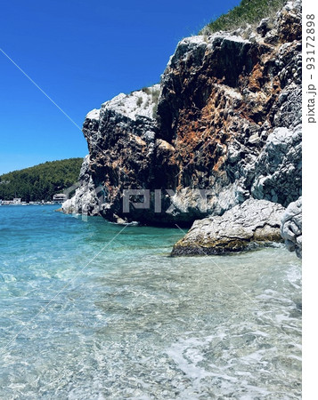 Rocky beach and crystal turquoise water of Ionian Sea in Albania. Rocky beach and crystal turquoise water of Ionian Sea in Albania. 93172898