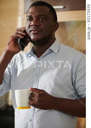 Anxious Black man Talking on Phone Anxious Black man Talking on Phone 93173039